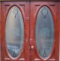 'TB Co Ld' monogram on doors at the Lass O' Gowrie