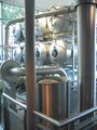A view of the conditioning tanks through the brewplant pipework. Note the grist in the grist case