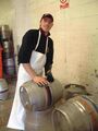 Liam Taggart scrubs the outside of the casks with a scotch pad
