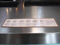 Tasting notes are displayed all along the stainless topped bar