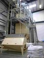 Materials handling with a dedicated conveyor for fruit peels which need to bypass the malt mill