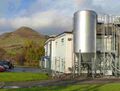 The brewery buildings with the Ochil Hills behind