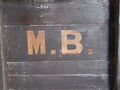 A close up of the 'MB' lettering