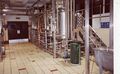 No (1a) This is a little bit more challenging as it is a shot of the insides of a brewery which we cannot identify
