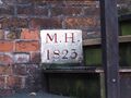 This marker dated 1823 is on an old malt house on the site