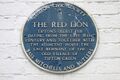 Red Lion, Tipton. This plaque was applied during the ownership of Bass, Mitchells & Butlers. Photo Mike Brown 2021.