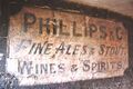 An old painted sign under an archway in a narrow Alley called Goldsmiths Lane: photo George Crutcher 2013